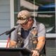 man standing at podium