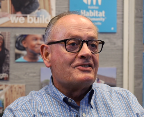 video thumbnail of volunteer speaking, click to hear