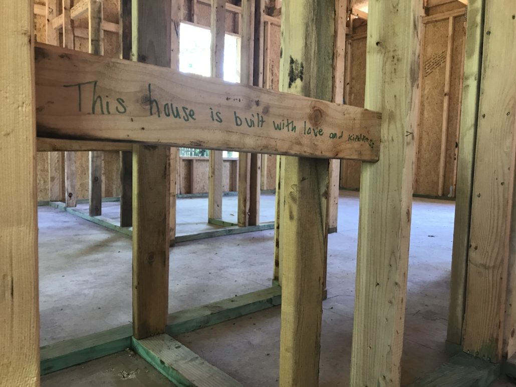 beam that says this house is built with love and kindness