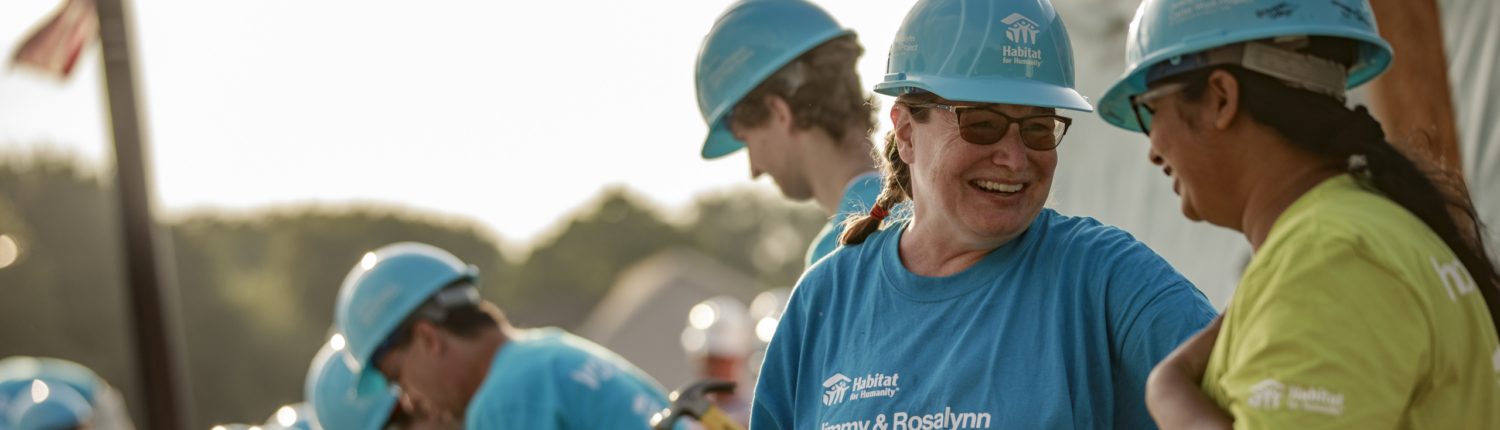 volunteers chat on the job site