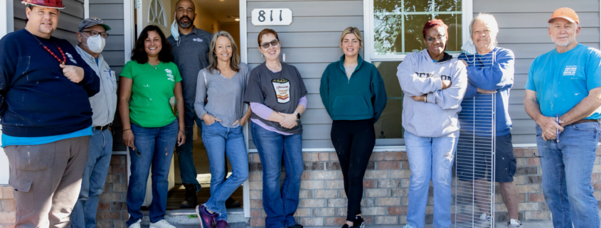 team of volunteers at a habijax house