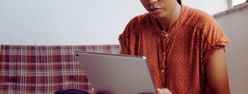 woman looking at ipad