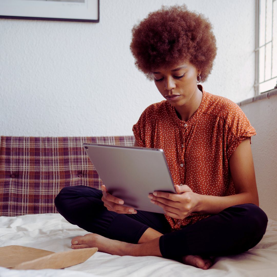 woman looking at ipad