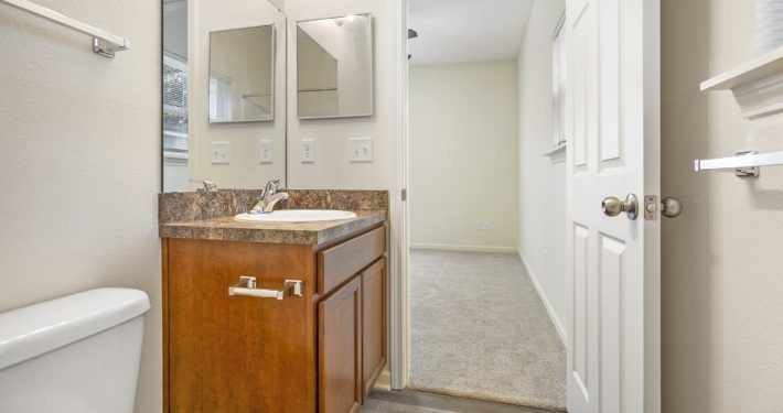 view of bedroom from inside bathroom