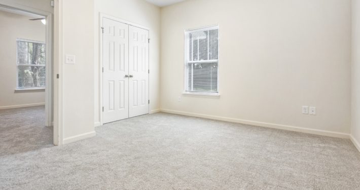 bedroom with double closet doors