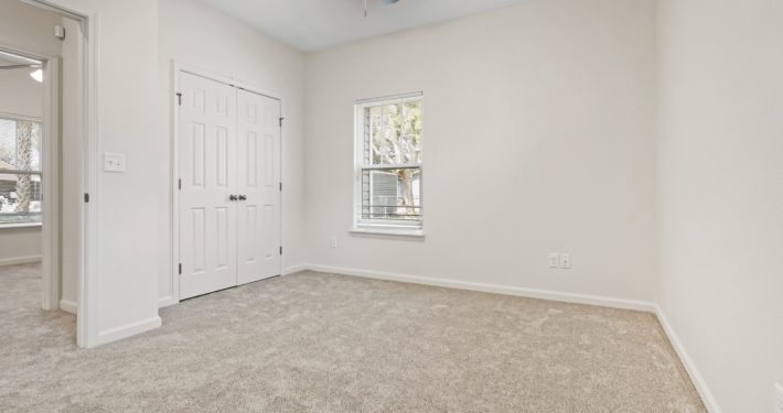 bedroom with closet and window