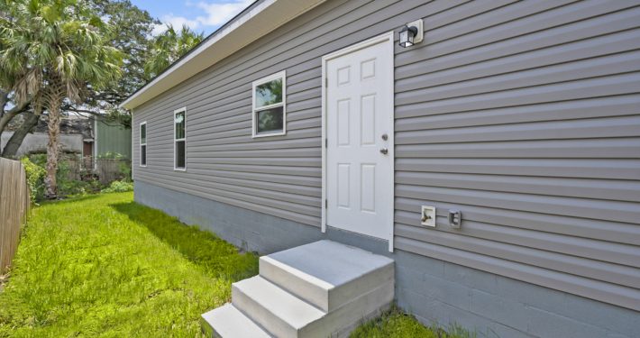 backdoor with stairs leading up from the ground