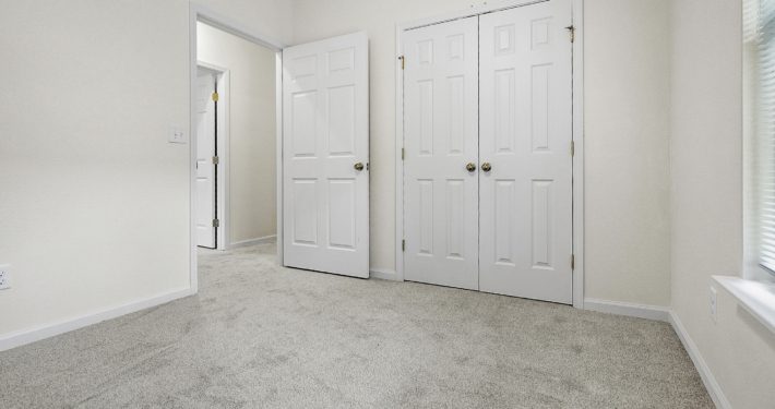 bedroom with closet doors