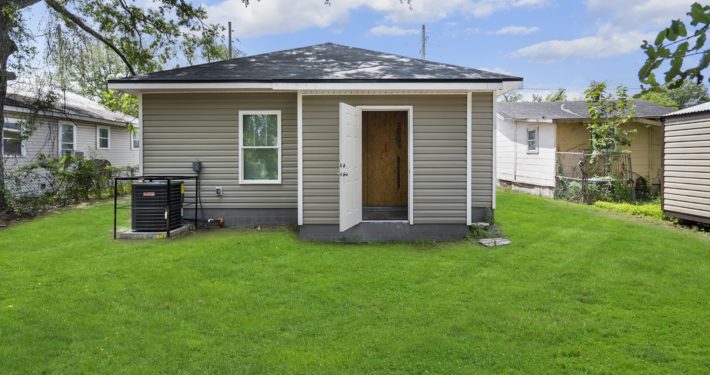 side entrance of the house with the door open