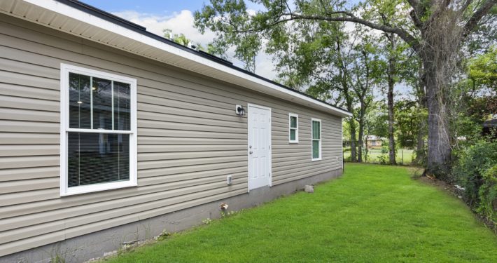 backside of a house showing the backyard