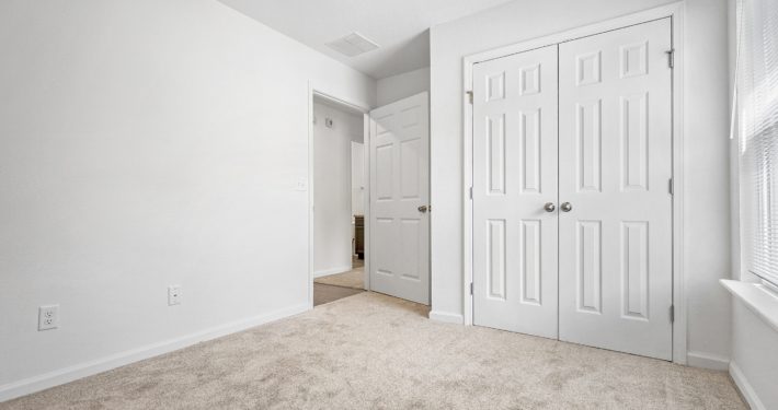 bedroom with double door closet