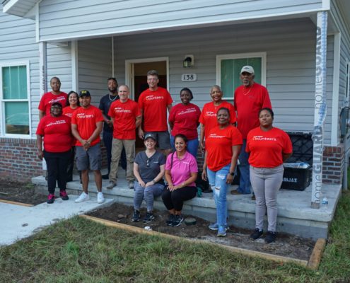 volunteers at a house