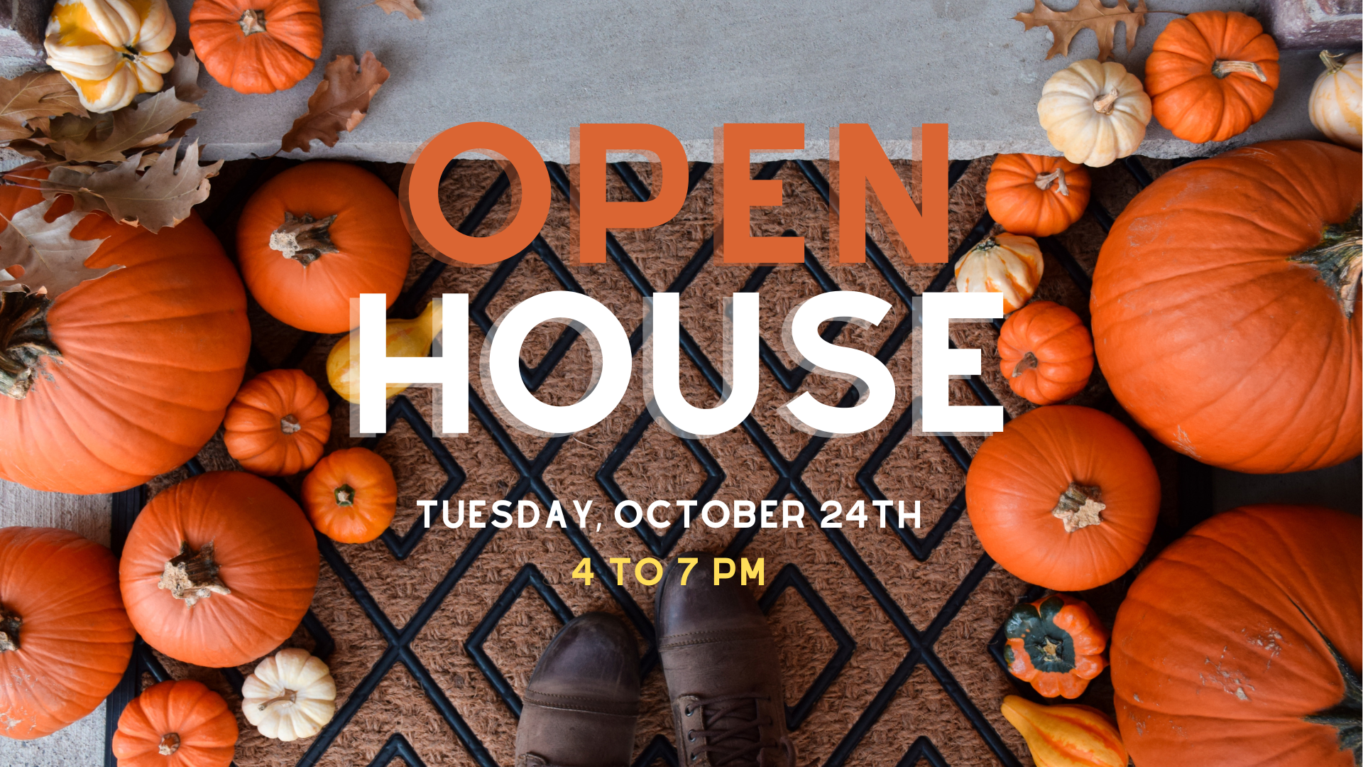 A person's feet are visible on a home's welcome mat surrounded by pumpkins